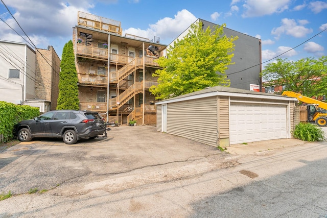 6351 N Glenwood Ave Unit 1S, Chicago, IL 60660 - view of building exterior featuring stairway and uncovered parking