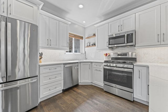 6351 N Glenwood Ave Unit 1S, Chicago, IL 60660 - kitchen featuring stainless steel appliances, crown molding, backsplash, dark wood-style floors, and recessed lighting