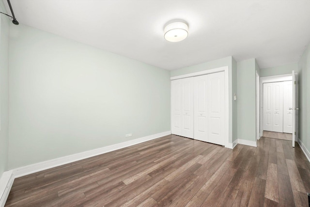 4113 W 97th Pl Unit 104, Oak Lawn, IL 60453 - unfurnished bedroom with dark wood-style floors and a closet