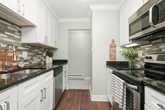 4113 W 97th Pl Unit 104, Oak Lawn, IL 60453 - kitchen with appliances with stainless steel finishes, baseboard heating, backsplash, crown molding, and dark wood-type flooring