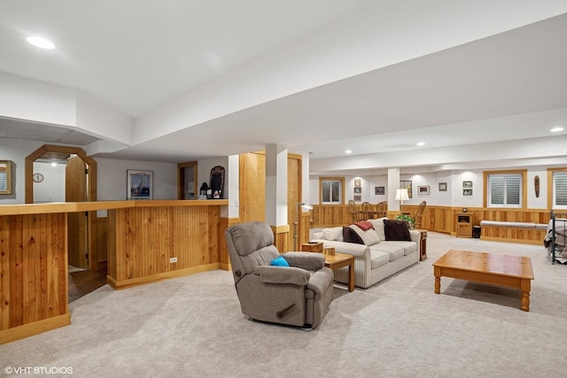 1709 Pebble Beach Ct, Hoffman Estates, IL 60169 - carpeted living area featuring a bar, wooden walls, recessed lighting, and a wainscoted wall