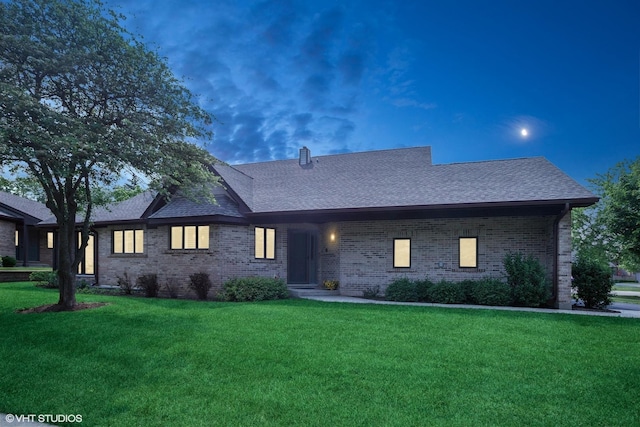 1709 Pebble Beach Ct, Hoffman Estates, IL 60169 - view of front of house featuring a front lawn, brick siding, and a shingled roof
