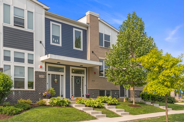 29W711 Cambridge St, Warrenville, IL 60555 - multi unit property with brick siding and a front lawn
