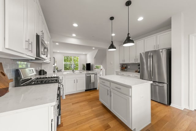 29W711 Cambridge St, Warrenville, IL 60555 - kitchen with stainless steel appliances, decorative backsplash, recessed lighting, light wood-style flooring, and white cabinets