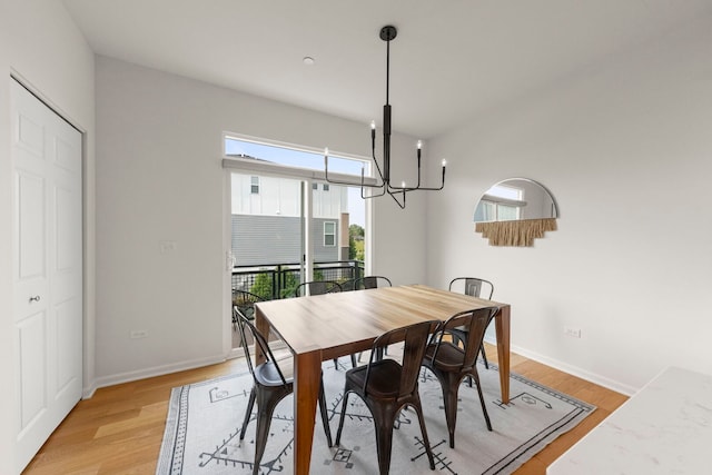 29W711 Cambridge St, Warrenville, IL 60555 - dining space with healthy amount of natural light, a chandelier, and light wood finished floors