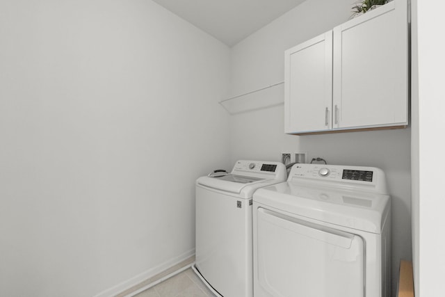 29W711 Cambridge St, Warrenville, IL 60555 - laundry area featuring cabinet space, washing machine and clothes dryer, and light tile patterned flooring