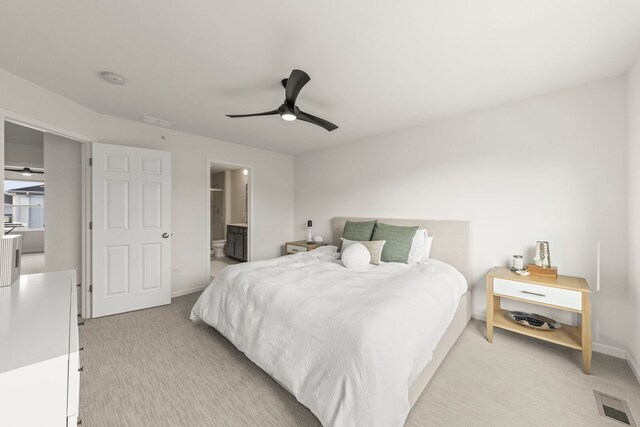 29W711 Cambridge St, Warrenville, IL 60555 - bedroom with light colored carpet, ceiling fan, and ensuite bath