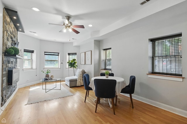 4857 N Drake Ave Unit G, Chicago, IL 60625 - dining space featuring a fireplace, a ceiling fan, wood finished floors, and recessed lighting