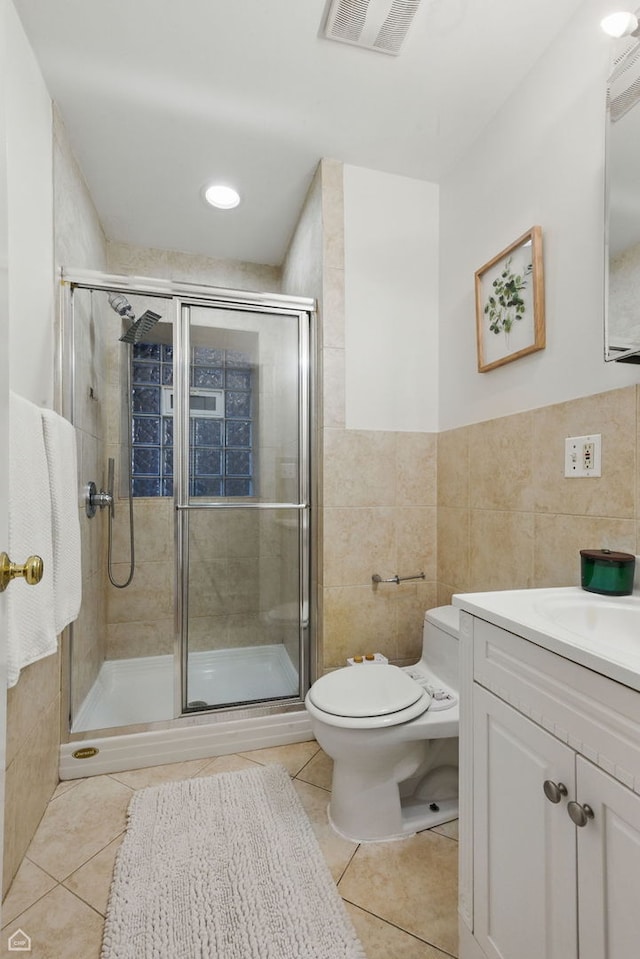 4857 N Drake Ave Unit G, Chicago, IL 60625 - bathroom featuring vanity, tile patterned floors, tile walls, and a shower stall