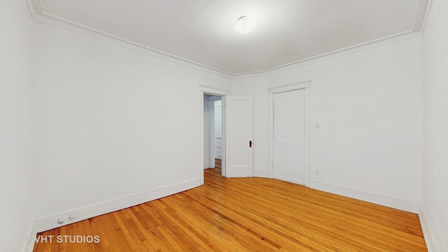 1646 E 54th St Unit 2, Chicago, IL 60615 - unfurnished room with light wood-type flooring and crown molding