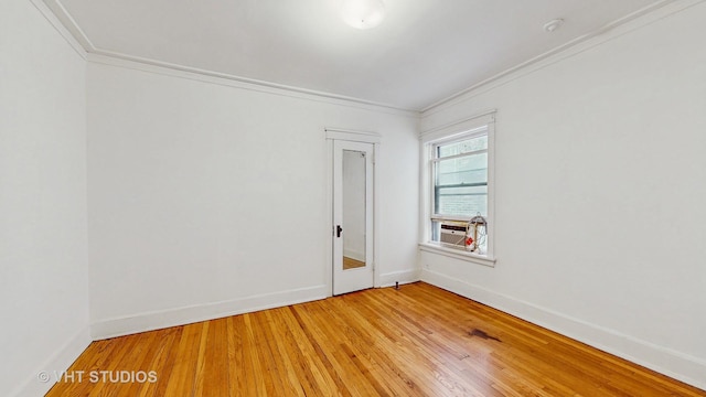 1646 E 54th St Unit 2, Chicago, IL 60615 - empty room with crown molding, light wood-style floors, and a smoke detector