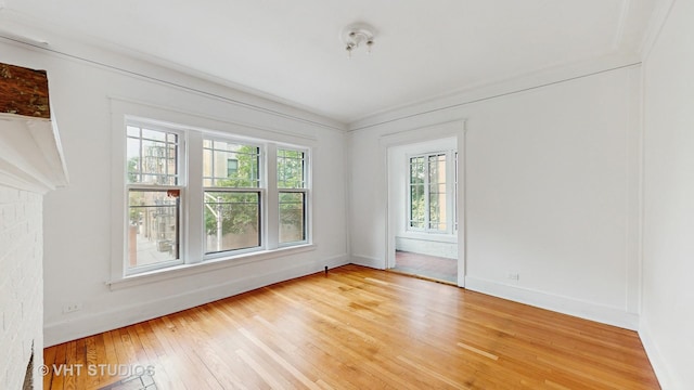 1646 E 54th St Unit 2, Chicago, IL 60615 - unfurnished room with light wood-style flooring and baseboards