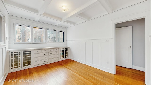 1646 E 54th St Unit 2, Chicago, IL 60615 - spare room featuring light wood-style floors, coffered ceiling, beamed ceiling, wainscoting, and a decorative wall