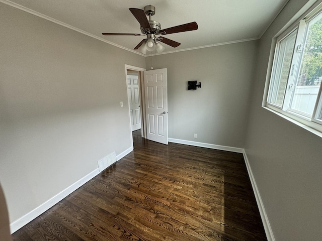 8117 S Keating Ave, Chicago, IL 60652 - empty room with dark wood finished floors, baseboards, a ceiling fan, and crown molding