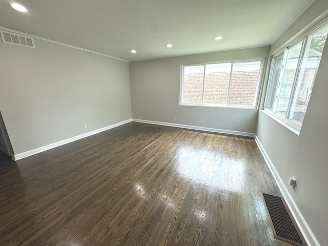 8117 S Keating Ave, Chicago, IL 60652 - empty room with dark wood finished floors, baseboards, crown molding, and recessed lighting