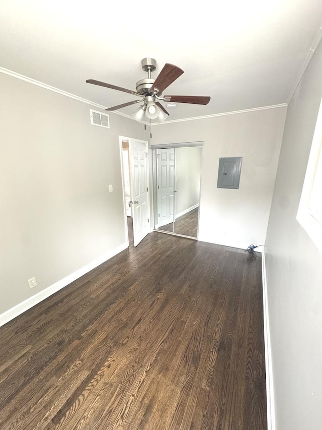 8117 S Keating Ave, Chicago, IL 60652 - empty room with ceiling fan, dark wood-type flooring, baseboards, crown molding, and electric panel