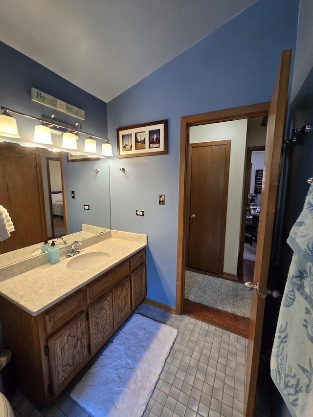 4910 143rd Pl, Midlothian, IL 60445 - full bathroom with lofted ceiling, tile patterned flooring, vanity, and baseboards