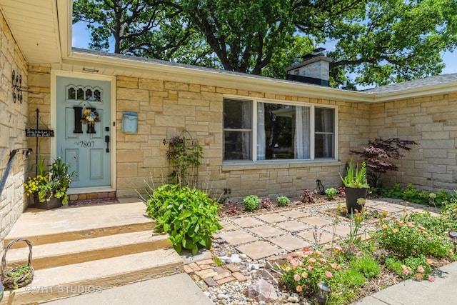 7807 Pershing Blvd, Kenosha, WI 53142 - property entrance featuring stone siding and a chimney