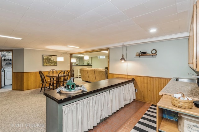 7807 Pershing Blvd, Kenosha, WI 53142 - kitchen with wainscoting, washer / clothes dryer, wood walls, and ornamental molding