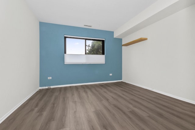 7200 N Ridge Blvd Unit 2K, Chicago, IL 60645 - unfurnished room featuring wood finished floors and baseboards