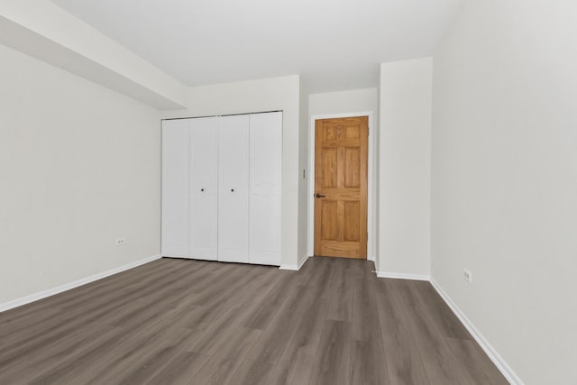 7200 N Ridge Blvd Unit 2K, Chicago, IL 60645 - unfurnished bedroom featuring dark wood finished floors and a closet