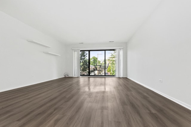 7200 N Ridge Blvd Unit 2K, Chicago, IL 60645 - empty room with dark wood finished floors and baseboards