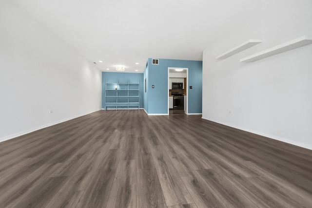 7200 N Ridge Blvd Unit 2K, Chicago, IL 60645 - unfurnished living room with dark wood-style floors and recessed lighting