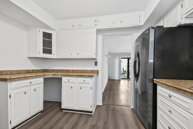 7200 N Ridge Blvd Unit 2K, Chicago, IL 60645 - kitchen with stainless steel fridge, white cabinetry, dark wood-style floors, and tile countertops