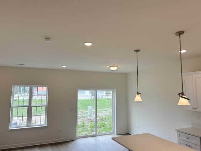 5400 135th St Unit 5406, Crestwood, IL 60418 - kitchen featuring white cabinetry, wood finished floors, light countertops, hanging light fixtures, and recessed lighting