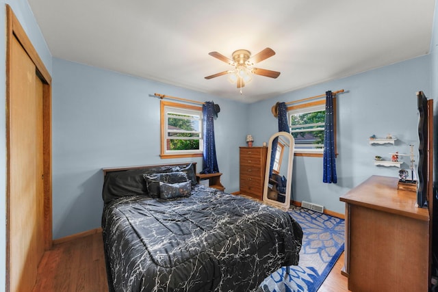 436 Marion St, Bensenville, IL 60106 - bedroom featuring wood finished floors, a closet, and a ceiling fan