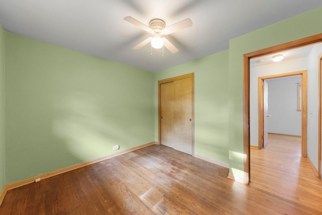 436 Marion St, Bensenville, IL 60106 - unfurnished bedroom featuring a closet, light wood-type flooring, and a ceiling fan