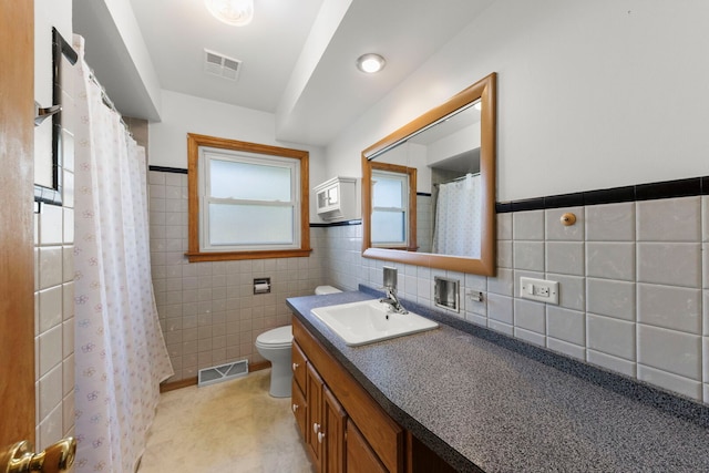 436 Marion St, Bensenville, IL 60106 - bathroom with tile walls, vanity, a shower with curtain, and a wainscoted wall
