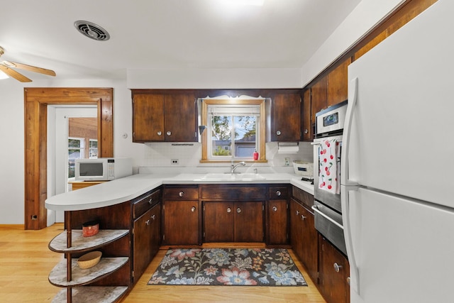 436 Marion St, Bensenville, IL 60106 - kitchen featuring white appliances, open shelves, a warming drawer, and light countertops