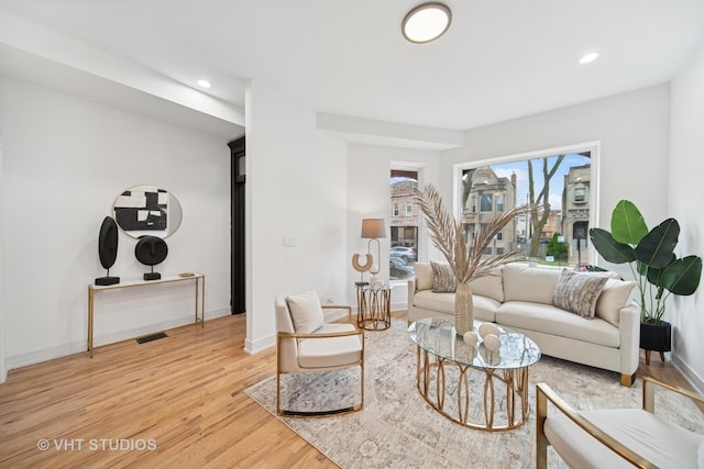 4752 S Champlain Ave, Chicago, IL 60615 - living room with light wood-type flooring, baseboards, and recessed lighting