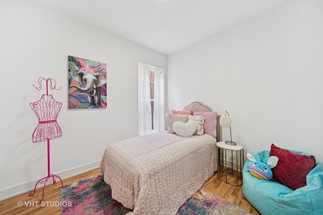 4752 S Champlain Ave, Chicago, IL 60615 - bedroom with baseboards and wood finished floors