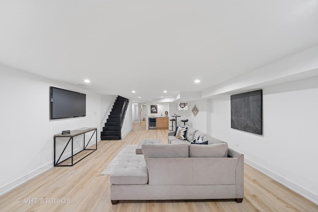 4752 S Champlain Ave, Chicago, IL 60615 - living area featuring light wood-style floors, baseboards, recessed lighting, stairway, and wine cooler