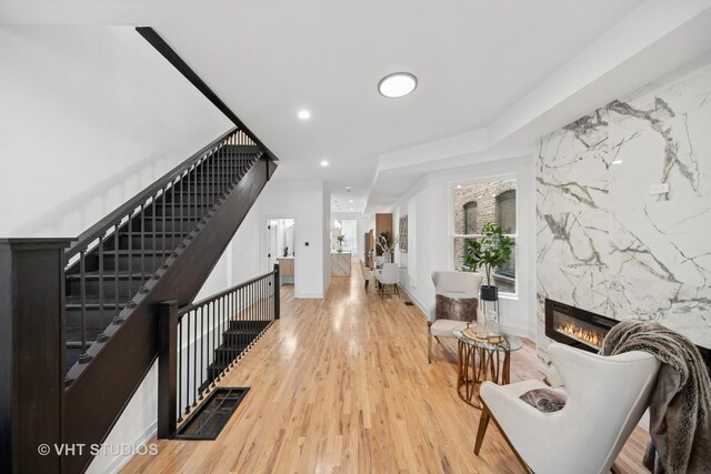 4752 S Champlain Ave, Chicago, IL 60615 - entrance foyer with light wood-type flooring, a fireplace, stairway, and recessed lighting
