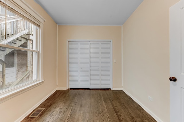 7955 S May St, Chicago, IL 60620 - unfurnished room with dark wood-type flooring and baseboards