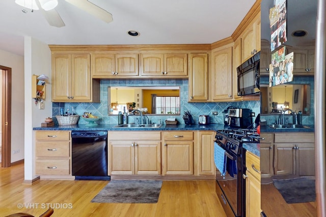 2834 Shelly Ln, Aurora, IL 60504 - kitchen featuring black appliances, a sink, dark countertops, and tasteful backsplash