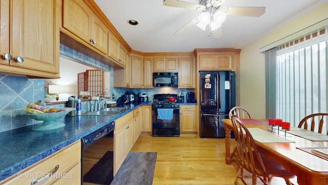 2834 Shelly Ln, Aurora, IL 60504 - kitchen featuring black appliances, a sink, light wood finished floors, decorative backsplash, and a ceiling fan
