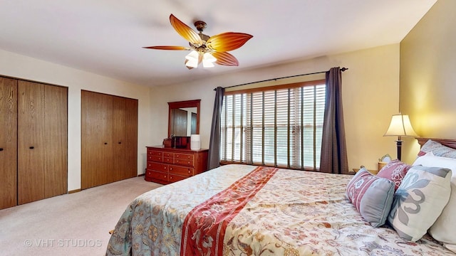 2834 Shelly Ln, Aurora, IL 60504 - bedroom featuring carpet floors, multiple closets, and a ceiling fan