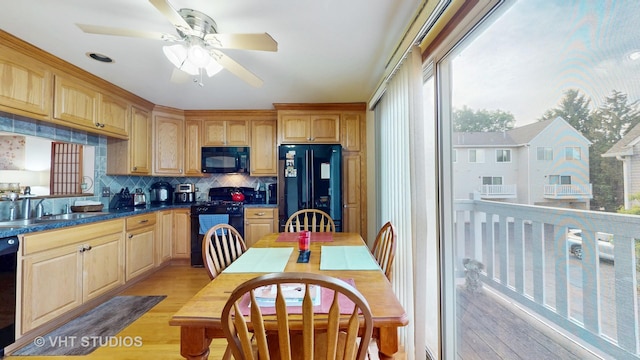 2834 Shelly Ln, Aurora, IL 60504 - kitchen featuring black appliances, a sink, light wood-style floors, tasteful backsplash, and a ceiling fan