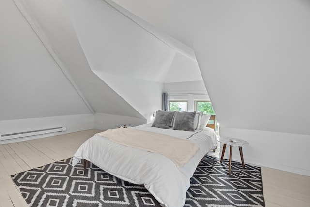 1419 W Birchwood Ave, Chicago, IL 60626 - bedroom with baseboard heating, vaulted ceiling, and wood finished floors