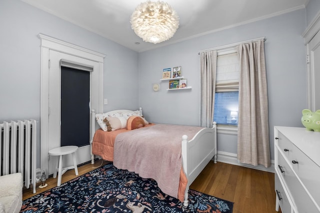 1419 W Birchwood Ave, Chicago, IL 60626 - bedroom featuring radiator, wood finished floors, and crown molding