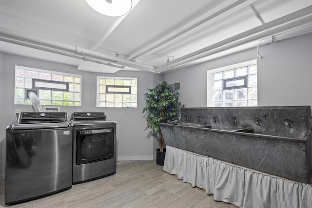 1419 W Birchwood Ave, Chicago, IL 60626 - laundry area featuring washer and dryer, wood finished floors, and healthy amount of natural light