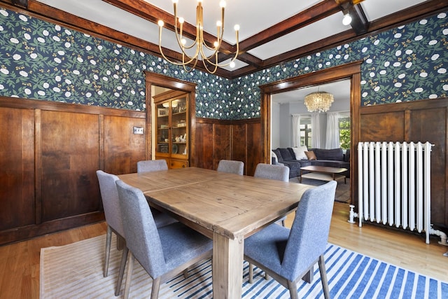 1419 W Birchwood Ave, Chicago, IL 60626 - dining space with radiator, a chandelier, wallpapered walls, wainscoting, and wood finished floors