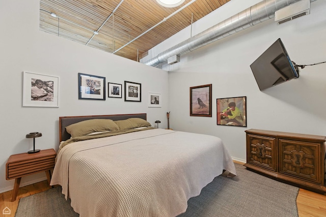 1670 N Claremont Ave Unit 109, Chicago, IL 60647 - bedroom with a towering ceiling and wood finished floors