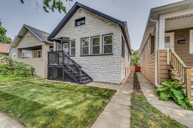 1132 Thomas Ave, Forest Park, IL 60130 - bungalow-style home featuring stone siding and a front yard