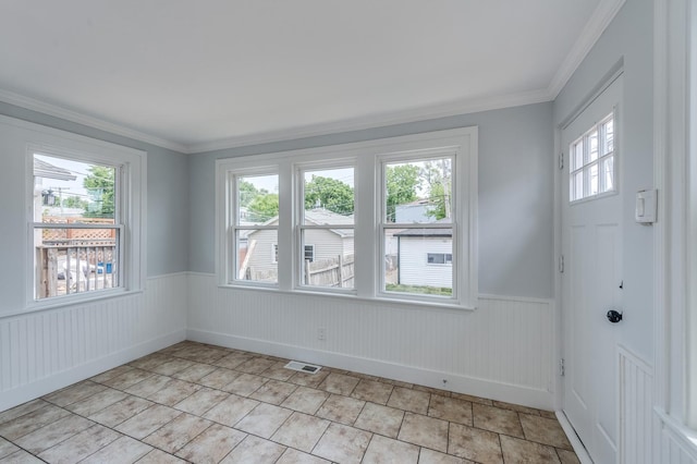 1132 Thomas Ave, Forest Park, IL 60130 - unfurnished room with plenty of natural light, a wainscoted wall, and ornamental molding
