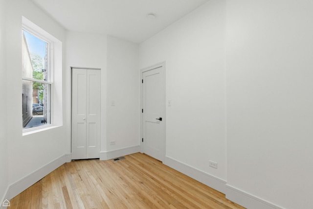 1928 W 21st St, Chicago, IL 60608 - unfurnished room with light wood-type flooring and baseboards